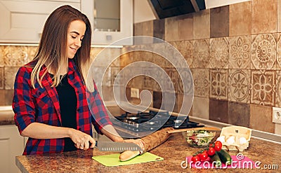 Indoor shot of female in kitchen during morning Stock Photo