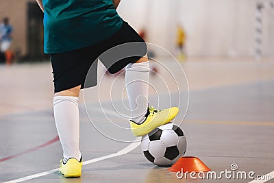 Indoor soccer player training with balls. Indoor soccer sports hall. Football futsal player, ball, futsal floor Stock Photo