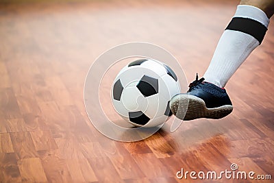 Indoor soccer sports hall. Football futsal player Stock Photo