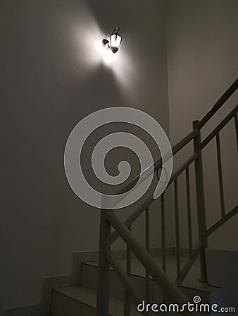 Indoor staircase light bulb at night Stock Photo