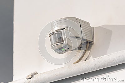 Indoor wall motion or light sensor for indoor lighting control Stock Photo