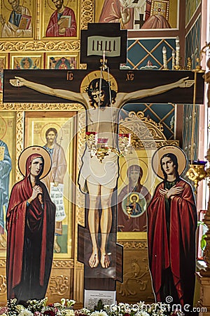Installation of Jesus on the cross in the Orthodox Church. Khanty-Mansiysk city, Russia - May 3, 2021 Editorial Stock Photo
