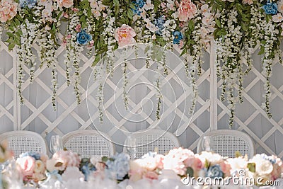 Indoors wedding decoration with acacia garlands Stock Photo