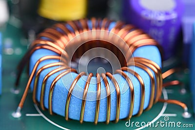 Inductor copper coil on circuit board Stock Photo