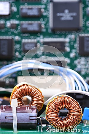 Inductor copper coil on circuit board Stock Photo