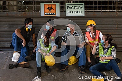 Industrail background of diverse factory workers, labors and engineer with wearing medical mask sitting together in front of Stock Photo