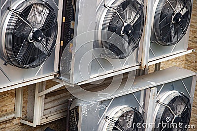 Industrial air-conditioning external units fixed on the external wall Stock Photo