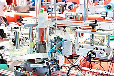 Industrial bottle labeling machine Stock Photo