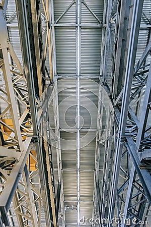 Industrial building ceiling with metal brace frame link. View from bottom to top Stock Photo