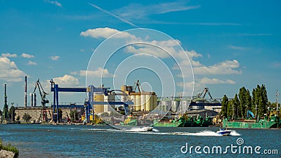 Industrial Cargo Port at the river. Stock Photo