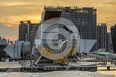 Industrial centrifugal fan and Exhaust vents of industrial air conditioning in ventilation systems. Skyscraper roof top from high Editorial Stock Photo