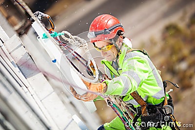 Industrial climber during insulation works Stock Photo