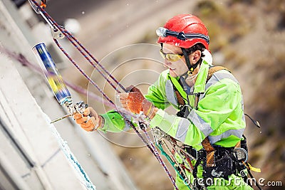 Industrial climber during winterization works Stock Photo