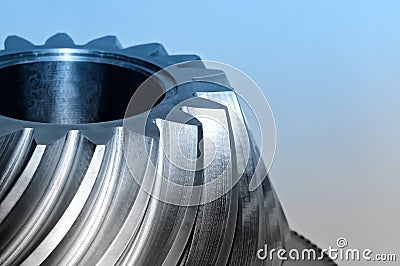 Industrial conical gear, cogwheel. Blue toned image. Stock Photo