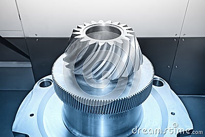 Industrial conical gear with spiral machine teeth. Blue toned Stock Photo