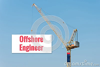 Industrial Construction crane holding a billboard Stock Photo