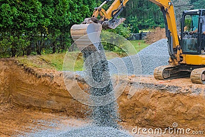 Industrial construction of foundation excavator moving gravel for building Stock Photo