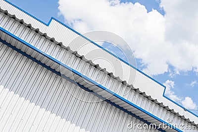 Industrial construction of Metal white sheet and blue corners. Roof sheet metal or corrugated roofs of factory building Stock Photo