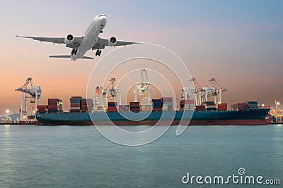 Industrial Container Cargo freight ship with working crane bridge in shipyard at dusk for Logistic Import Export background Stock Photo