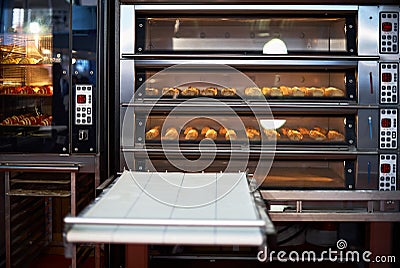 Industrial convection oven with cooked bakery products for catering. Professional kitchen equipment Stock Photo