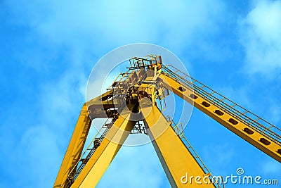 Industrial Crane operating and lifting an electric generator Stock Photo