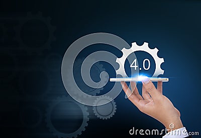 Industrial 4.0 Cyber Physical Systems concept, Gears industry4.0 icons on smartphone by business hand. Stock Photo