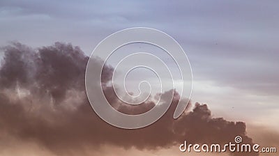 Industrial dark smoke on the sunset background Stock Photo