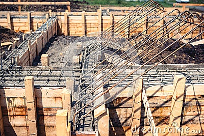 Industrial details - construction site of new house, building. Foundation, cement and steel bar infrastructure reinforcement Stock Photo