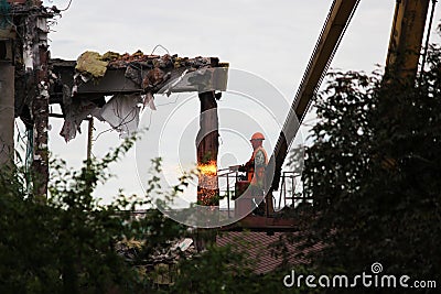 Industrial dismantle, mechanical destruction. Dismantling of the building with the help of gas-oxygen torch. Editorial Stock Photo