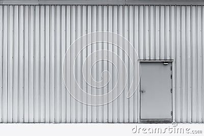 Door on aluminium wall factory warehouse. Stock Photo