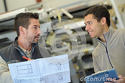 Industrial engineer discussing plan Stock Photo