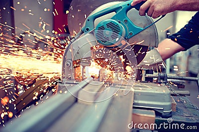 Industrial engineer working on cutting a metal and steel Stock Photo