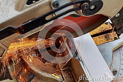 industrial engineer working on cutting a metal and steel with compound mitre saw sharp, circular blade Stock Photo