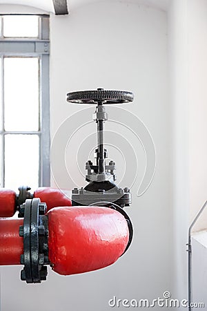 Industrial environments with pipes and tap Stock Photo