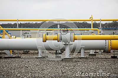 Industrial equipment pipes, manometer/pressure gauge, levers, faucets, indicators in a natural gas compressor station Stock Photo