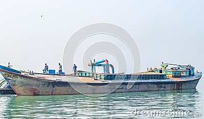 The industrial extraction of sand for construction. The pipe abrasives sand with water under strong pressure. Stock Photo