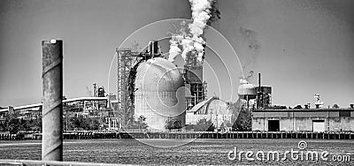 Industrial facility. Exterior of modern petrochemical plant with reactors and converters. Smoke from the chimney Stock Photo