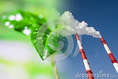 Industrial factory chimneys on background of green plants . Stock Photo