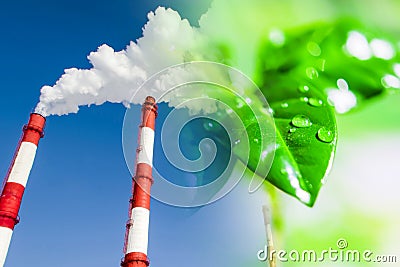 Industrial factory chimneys on background of green plants . Stock Photo