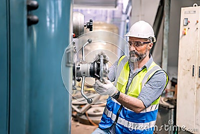 Industrial factory concept. Engineering with technicain and worker operating and maintenance Stock Photo