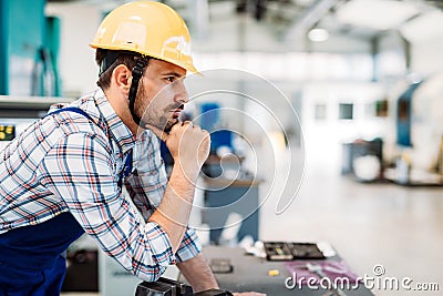 Industrial factory employee working in metal manufacturing industry Stock Photo