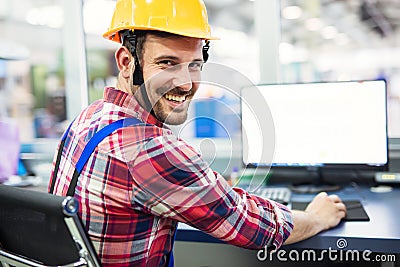 Industrial factory employee working in metal manufacturing industry Stock Photo