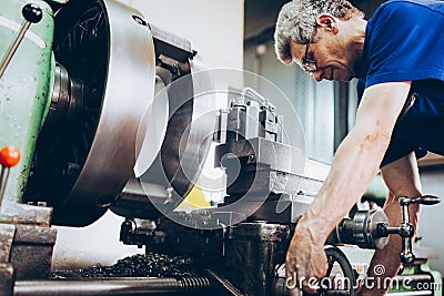 Industrial factory employee working in metal manufacturing industry Stock Photo