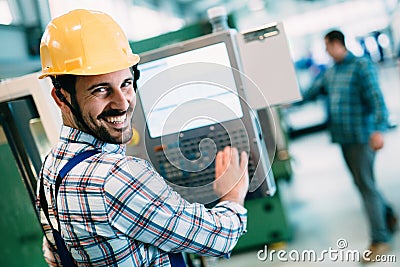 Industrial factory employee working in metal manufacturing industry Stock Photo