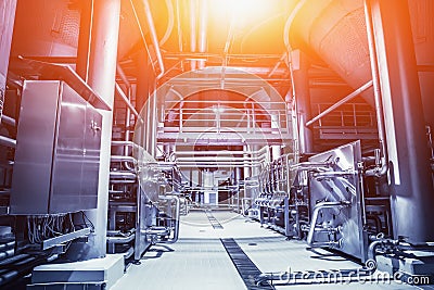 Industrial factory, steel pipelines, tubes at brewery production. Blue toned Stock Photo