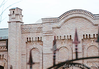 Industrial historic Architecture, brick house with iron fence. Manufactory Stock Photo