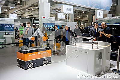 Industrial KUKA robot in booth of Huawei company at CeBIT Editorial Stock Photo
