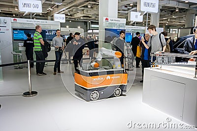 Industrial KUKA robot in booth of Huawei company at CeBIT Editorial Stock Photo