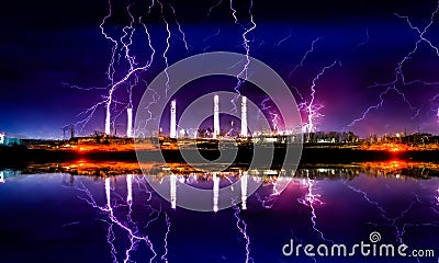 Industrial landscape with smoking chimneys and reflection in water at night Stock Photo