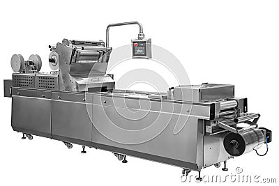 Industrial line for packaging of food products. Packing of bread at the factory.The machine for cutting and packing in a factory f Stock Photo